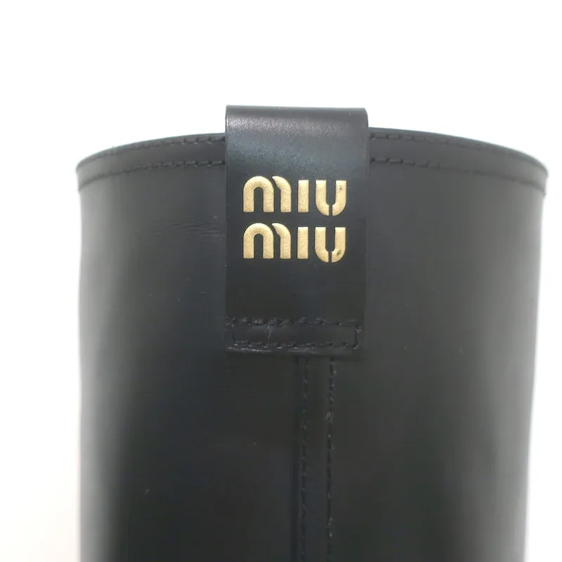 Bottes mi-hautes à enfiler détaillées avec logo Miu Miu en cuir noir taille 37
