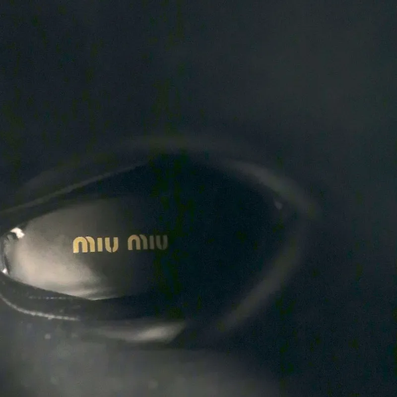 Bottes mi-hautes à enfiler détaillées avec logo Miu Miu en cuir noir taille 37
