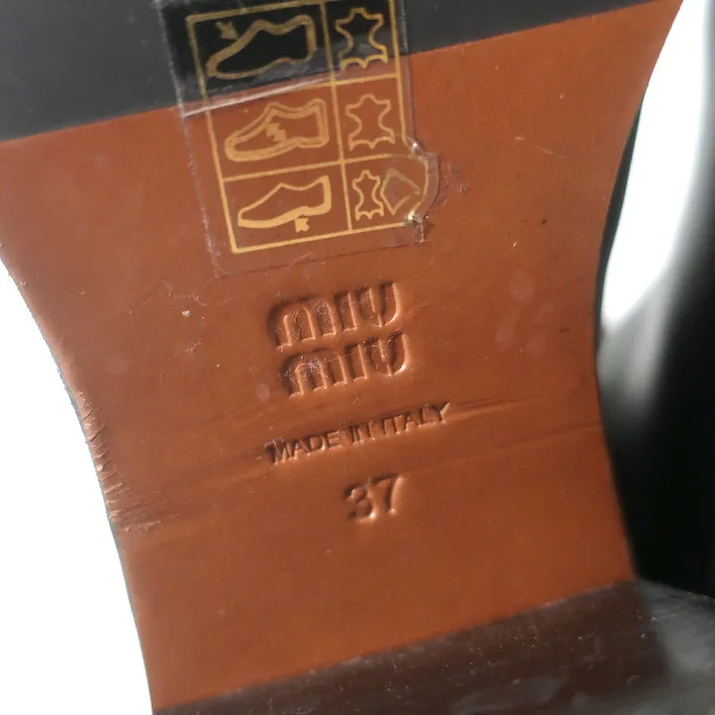 Bottes mi-hautes à enfiler détaillées avec logo Miu Miu en cuir noir taille 37